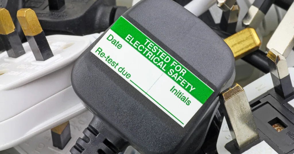 Electrical plug marked with a tested for electrical safety label