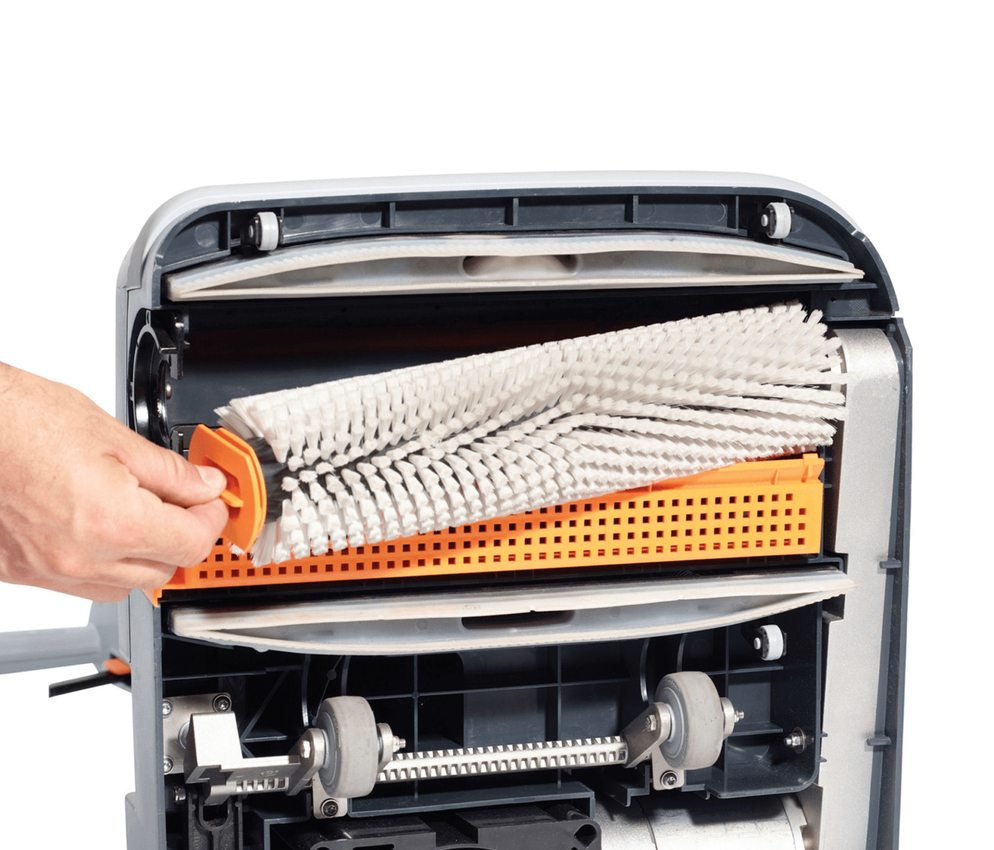 Nilfisk SC100 scrubber drier brush being removed for servicing